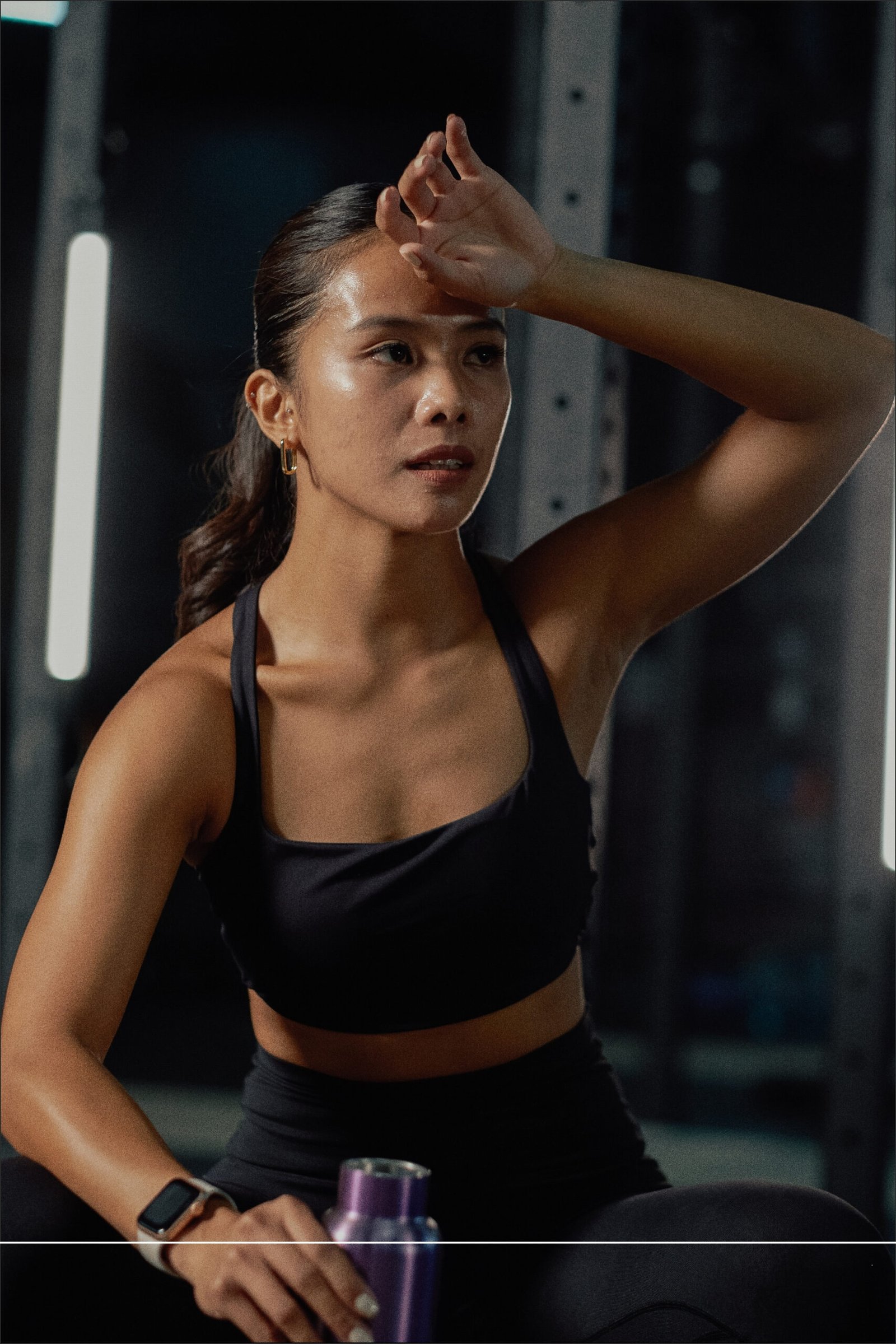 Client catching their breath after a hard training set at Impact Fitness Oakland